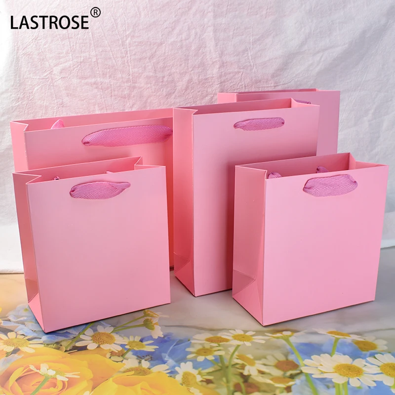 Wholesale Pink Luxury Eyelashes Packaging Paper Shopping Bag With Handle Private Label Empty Paper Gift Bags