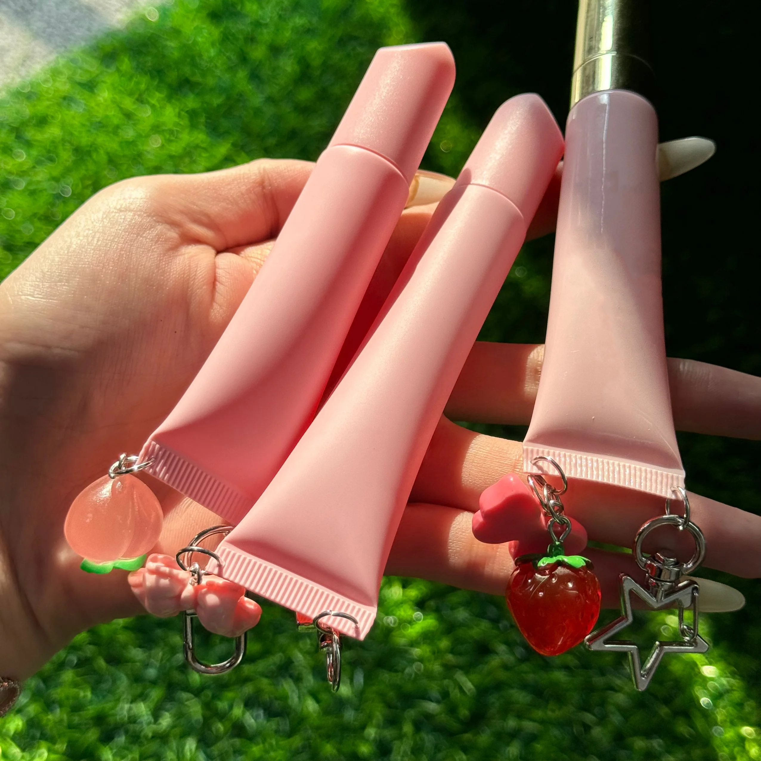 Private label DIY cute  squeeze keychain lip tube lip balm packaging custom volume plastic squeeze lipgloss tube for kids