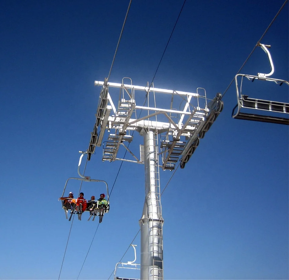 Ropeway chairlift with  four seats for four persons one chair  in ski resort ski area