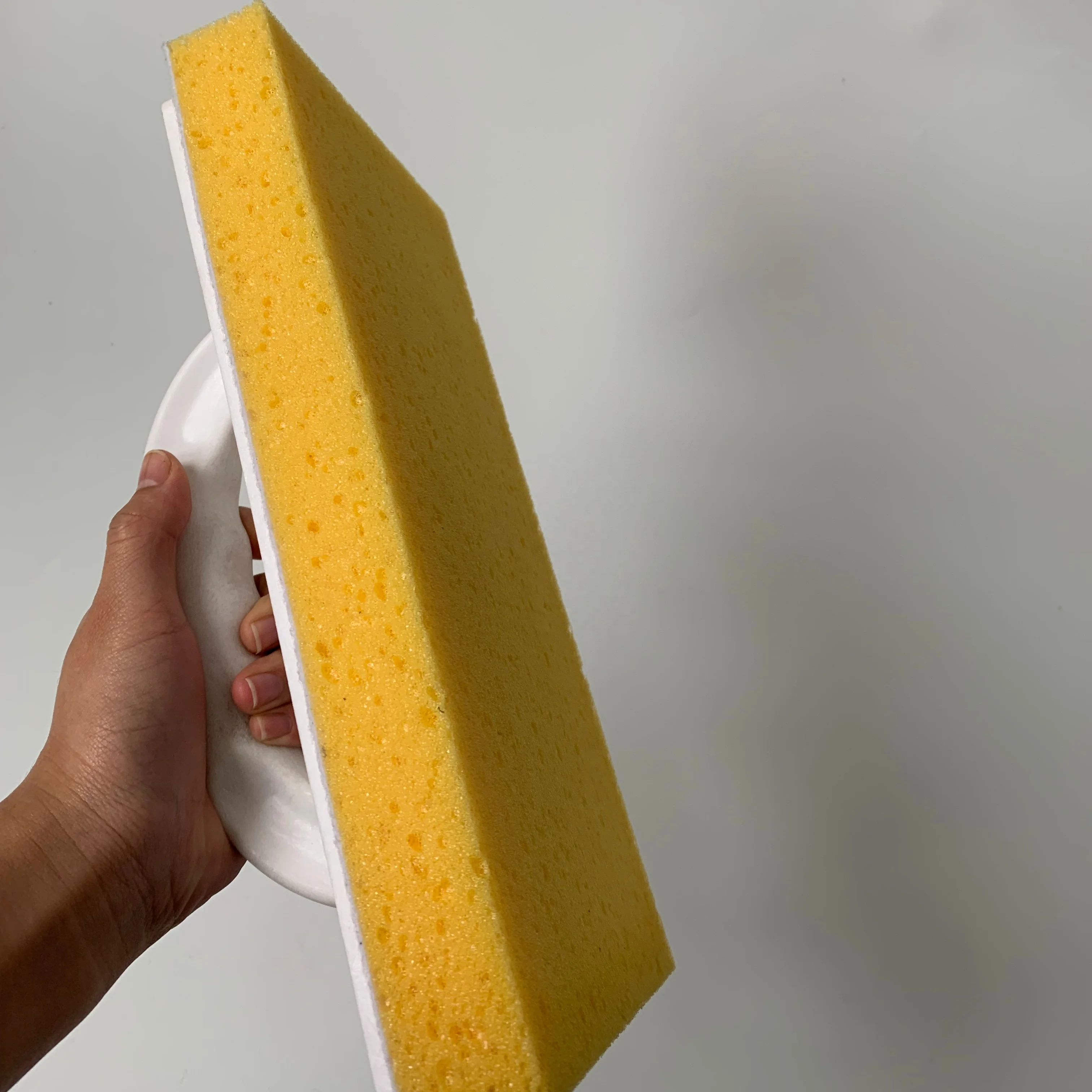 yellow open cell sponge with plastic white color handle foam trowel