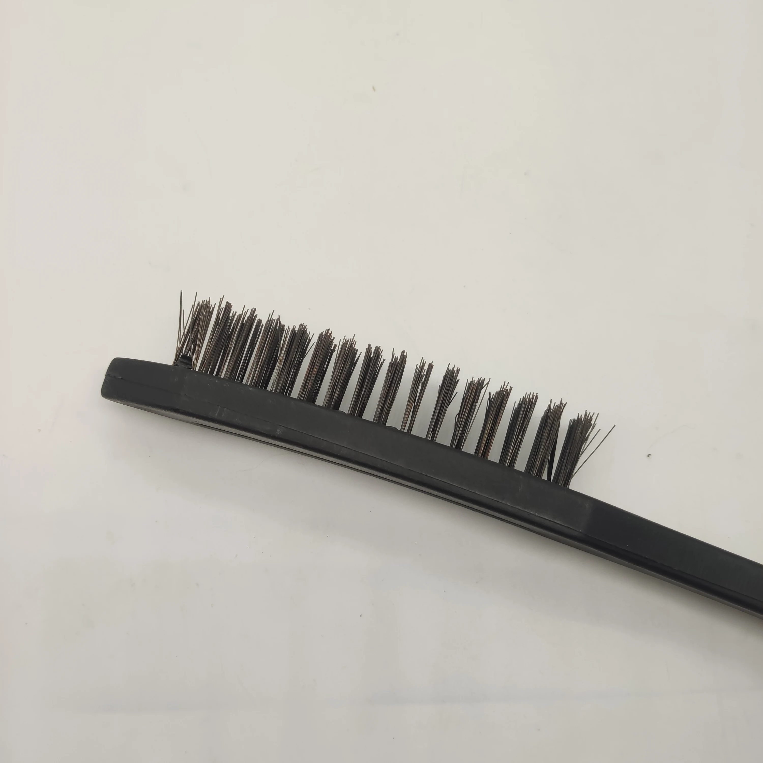 Carbon steel wire brush with black plastic handle for cleaning