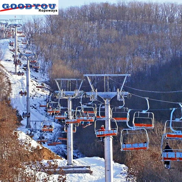 Ropeway chairlift with  four seats for four persons one chair  in ski resort ski area