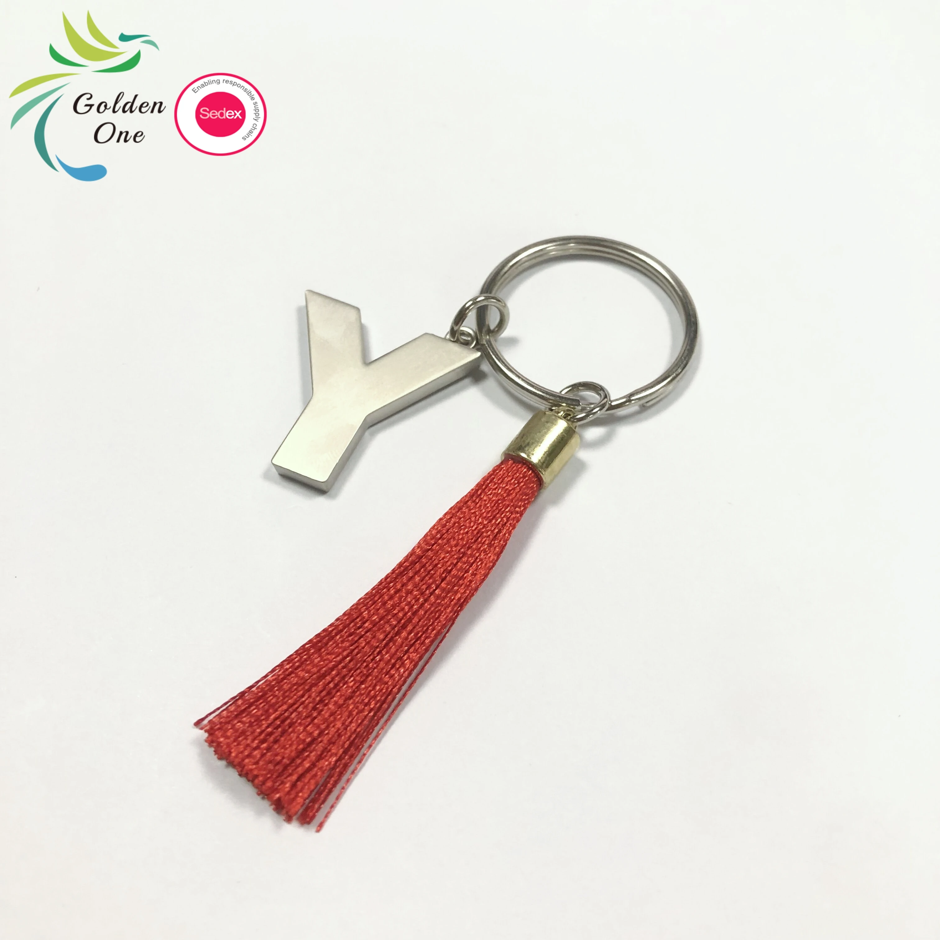 new design manufacturer colored fringe gift key chain 26 letters printing logo fashion metal keychain for bags