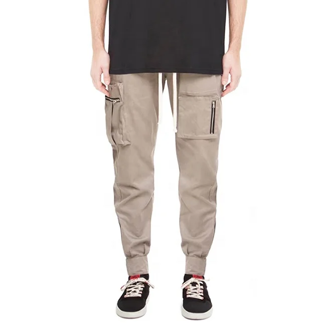 
Low moq street multi zipper pockets pencil pants solid color elastic drawstring jogger pants popular casual cargo pants stock 
