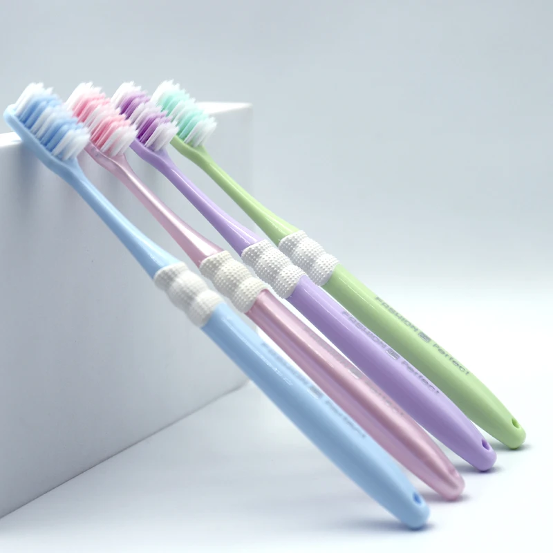 Factory wholesale custom logo shaped hole bristles plastic adult toothbrush