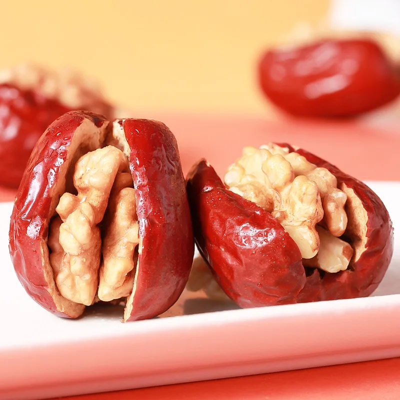 Handmade walnut kernels and red dates for producing nut snacks