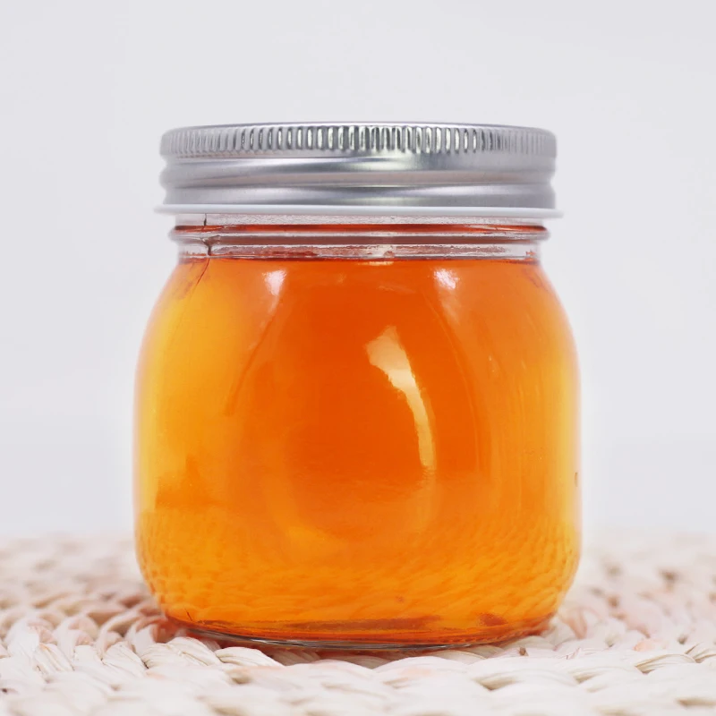 Brand authorization 250ml round glass honey storage jar custom craft design with aluminum cover