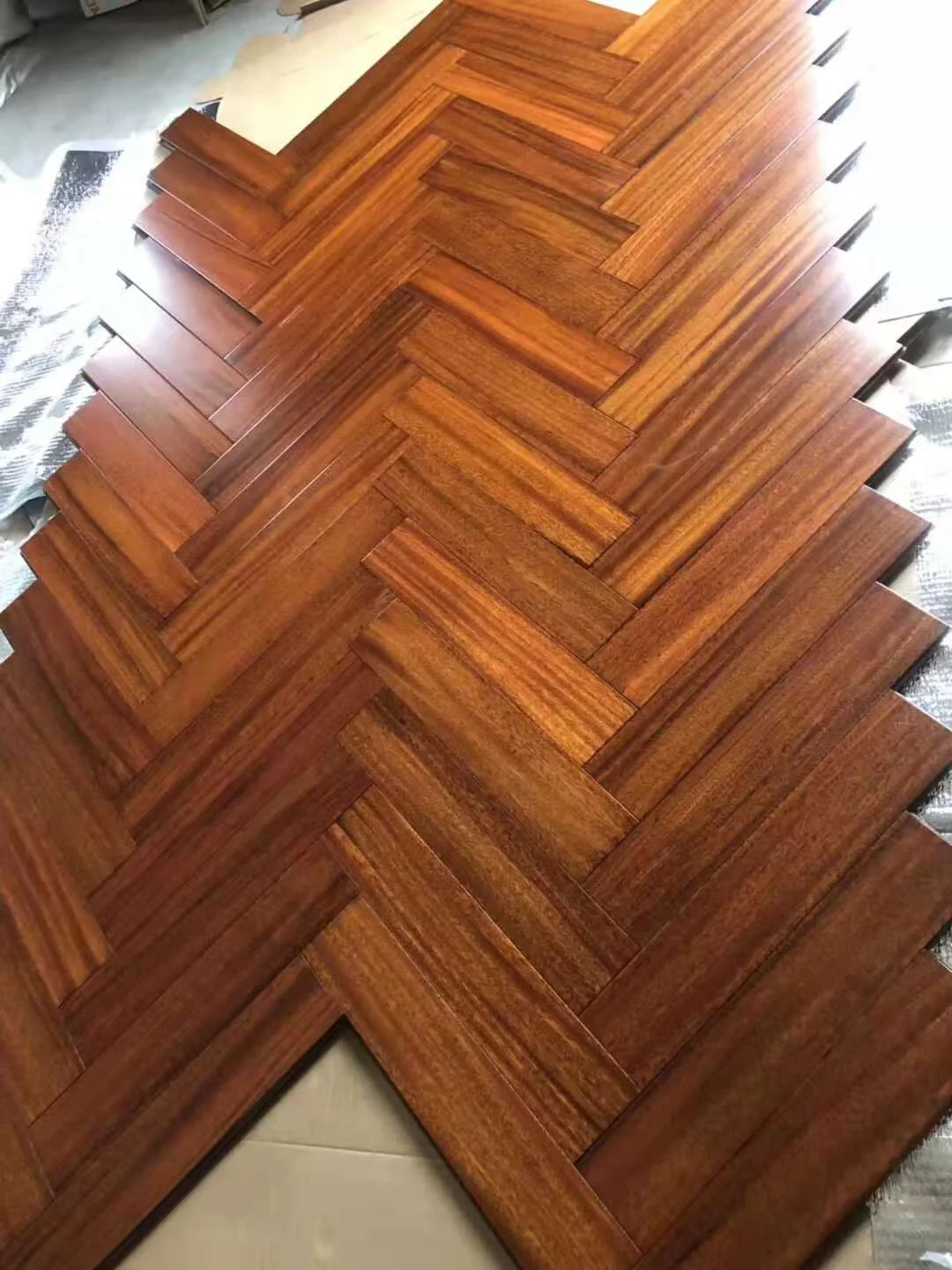 natural UV iroko herringbone parquet wood floor