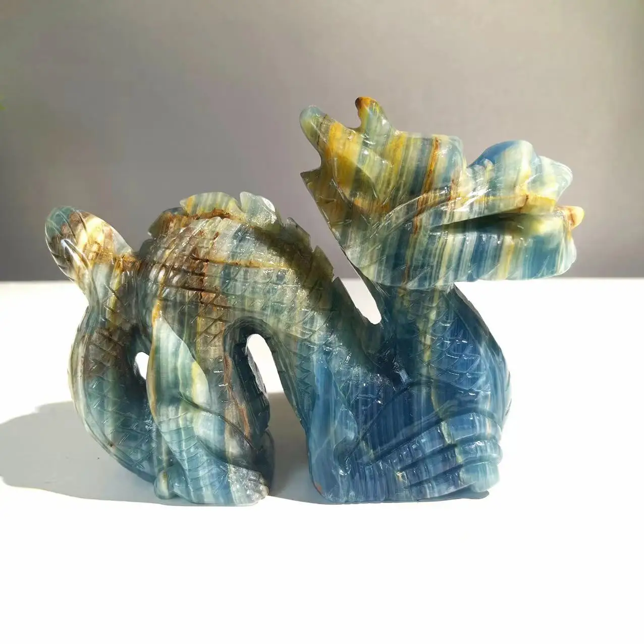 Hot sale natural high quality crystal hand carving blue onyx dragon crystal crafts for decoration.