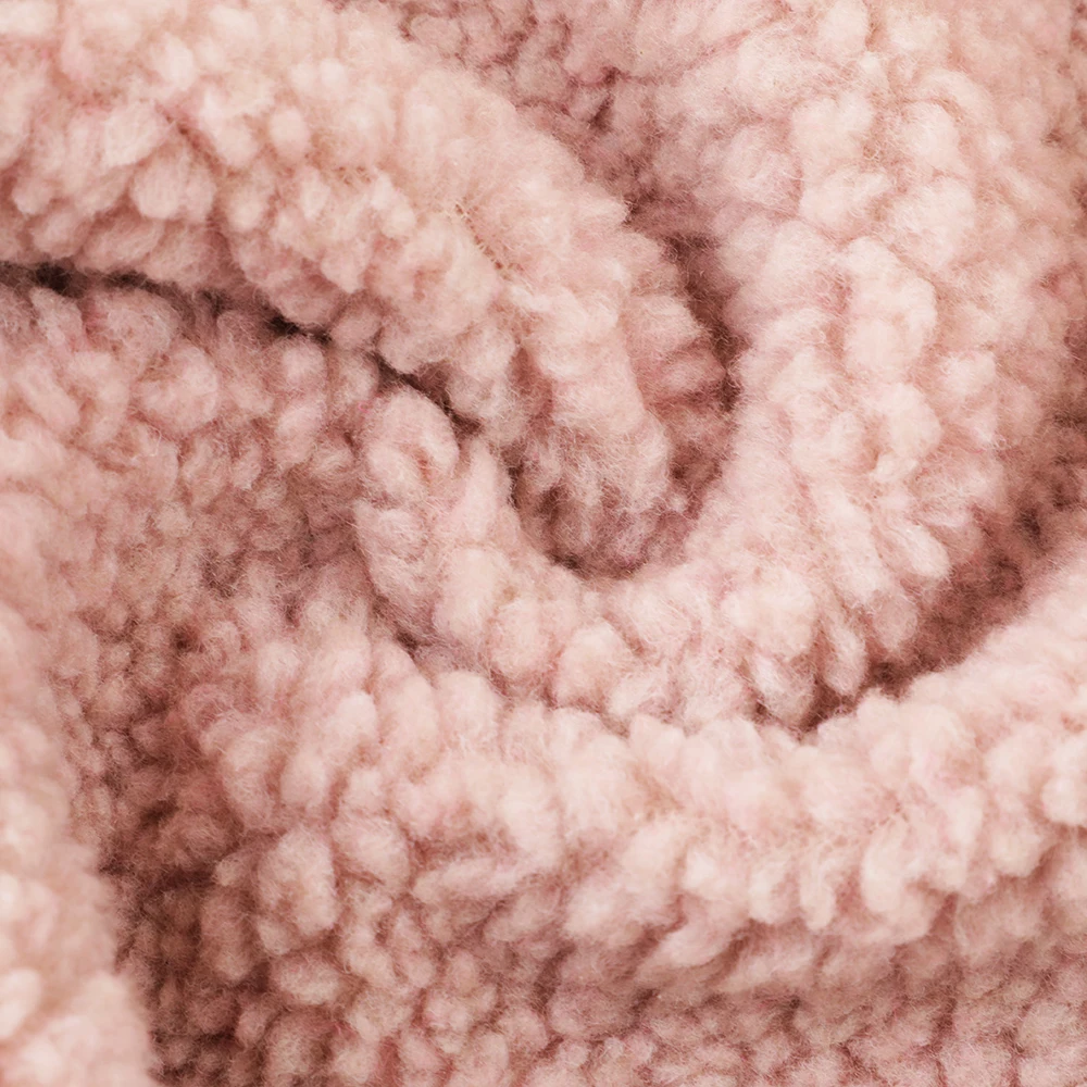 Hot selling winter warm thick polyester solid super soft flannel plush fabric for pajamas