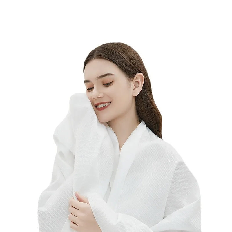 Compressed bath towel thickened and increased disposable portable individually packaged non-woven 70x140