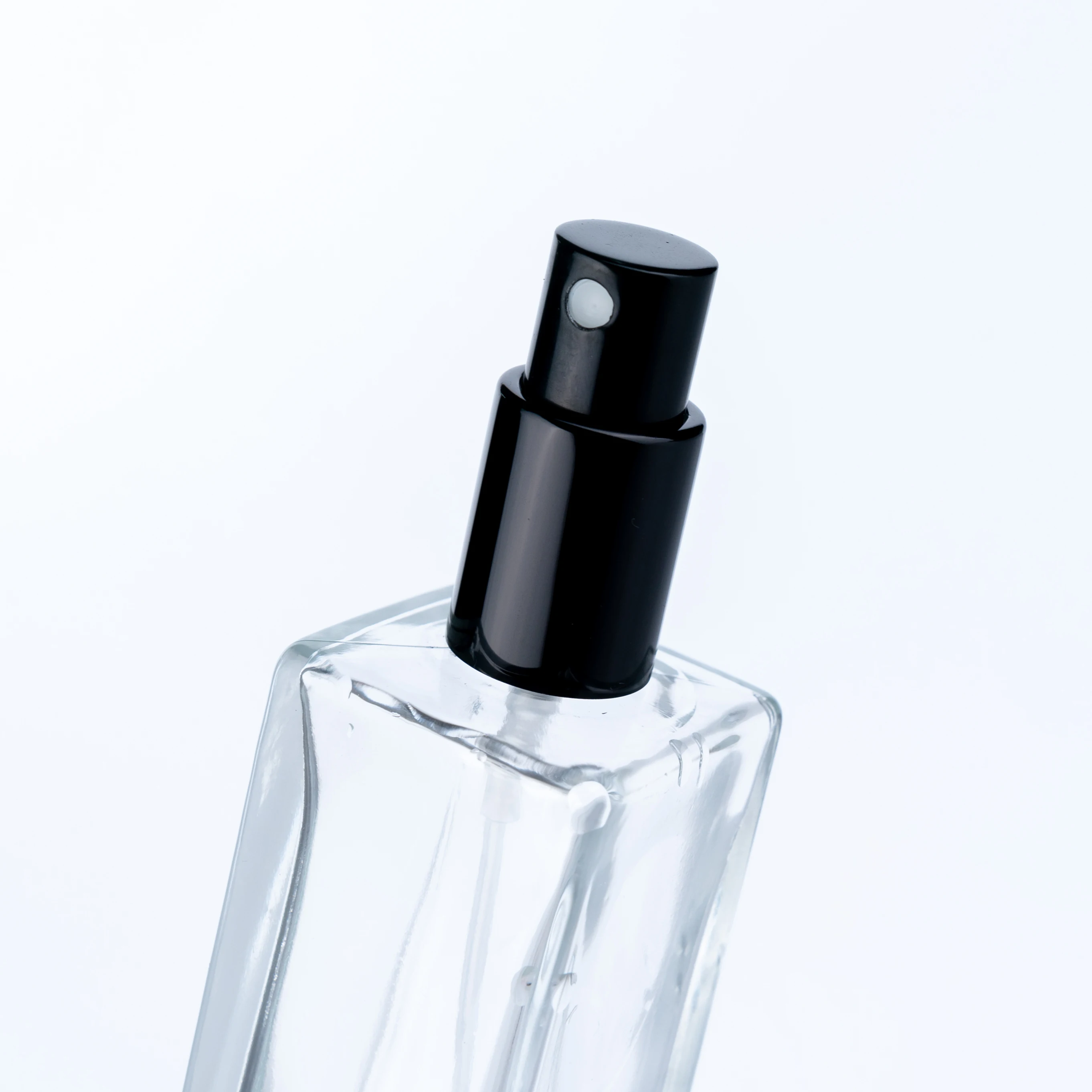 
The Customized High Quality 100ml Transparent Bottle With Black Round Cap Square Tall Perfume Bottle 