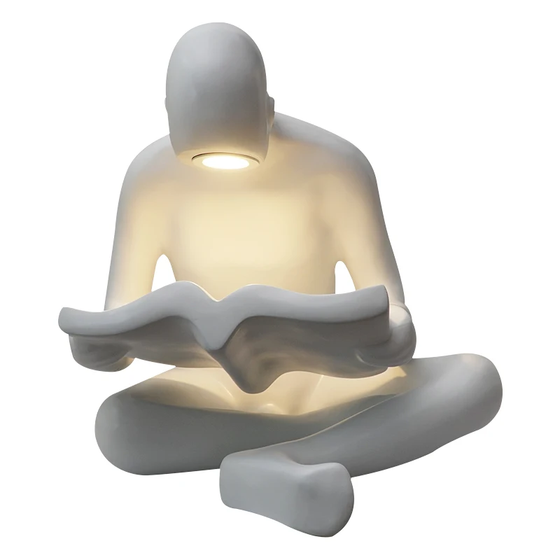 
Figurine manufacturers kid reading human sculpture for library 