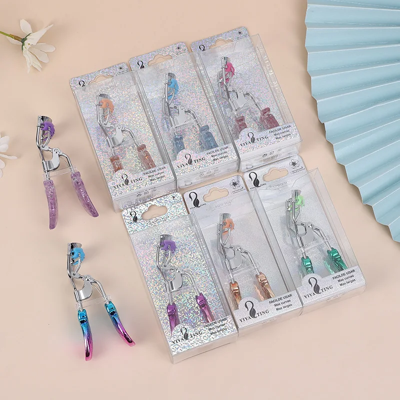 Portable luxury eyelash clip with peach and pineapple handles, available in multiple colors