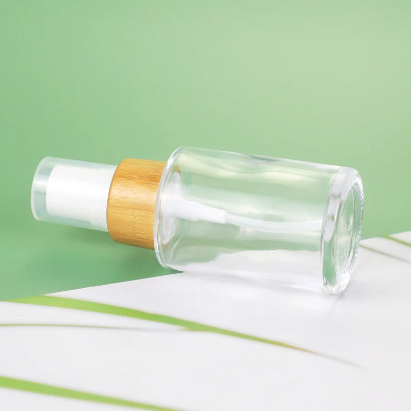 
Factory Custom Gold Cap Green Clear 100ml Glass Dropper Bottle Glass Lotion Pump Bottle 