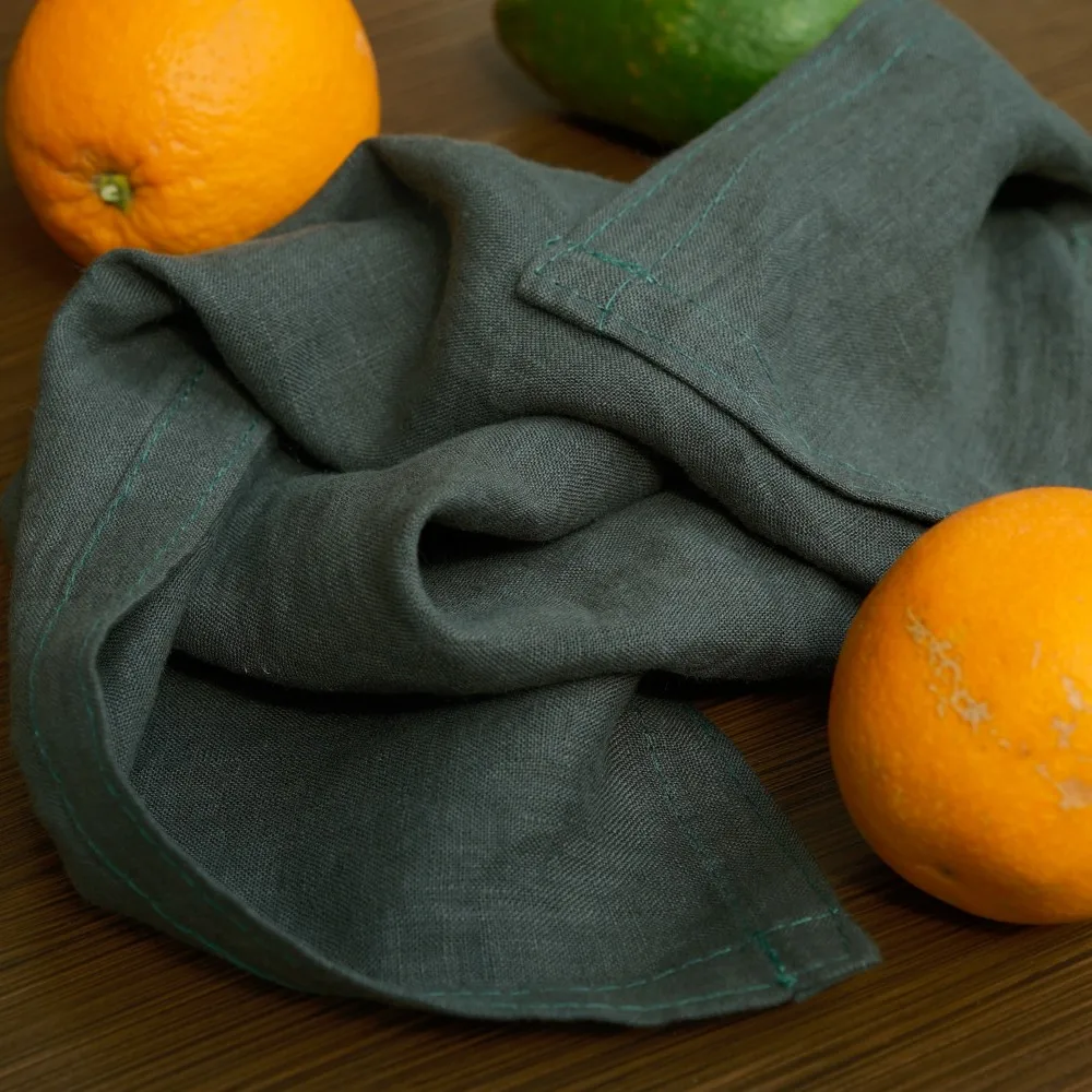 Sustainable dark green linen table napkin with casual feel