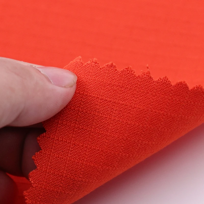 32s 210gsm ripstop IIIA Aramid Kevlar Fabric Orange Piece Dyed Flame Retardant Woven Twill for Garments Firefighters  Workwear