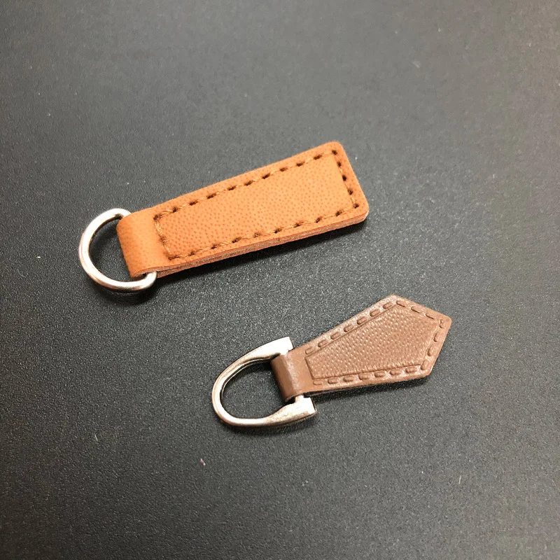 Custom logo PU Leather Zipper Pulls Zipper Tags Fixer Wholesale Garment Accessories Durable Boot Zipper Heads for Bags Jacket
