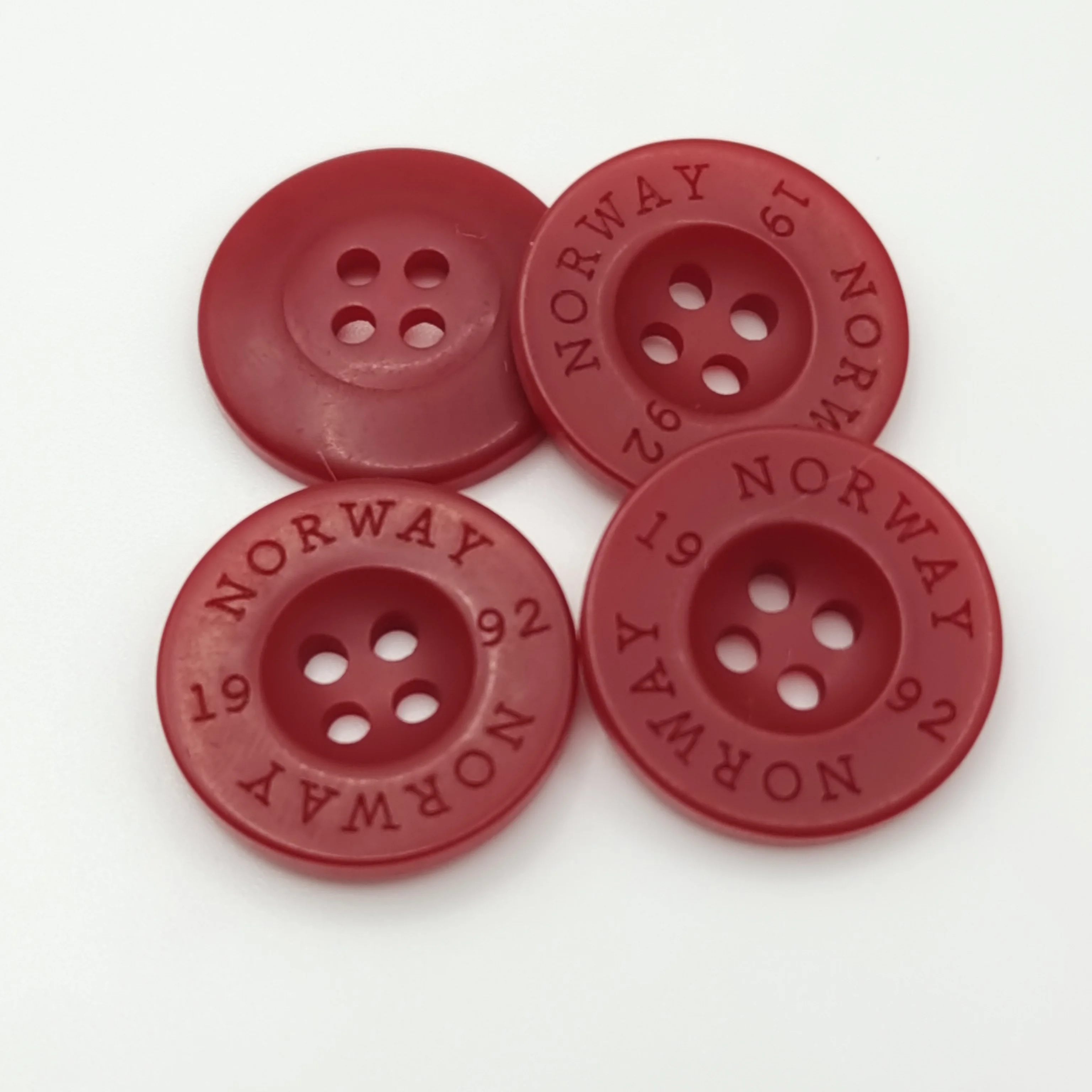 China Custom Colored  Red  bFlat 4 Holes Round Polyester Resin Big Size garment Buttons