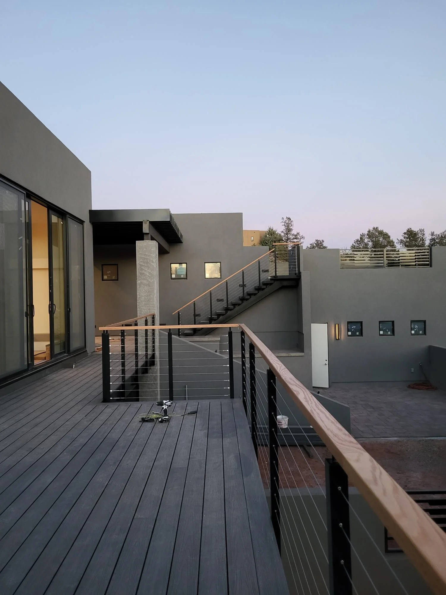 Black aluminum cable railing post with wooden handrail cable railing design