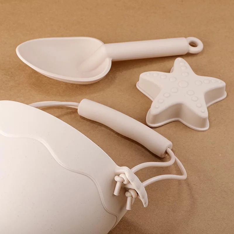 Best Selling Children Summer Outdoor BPA Free Food Grade Silicone Beige White Shovel Bucket Baby Beach Sand Toys Set for Kids