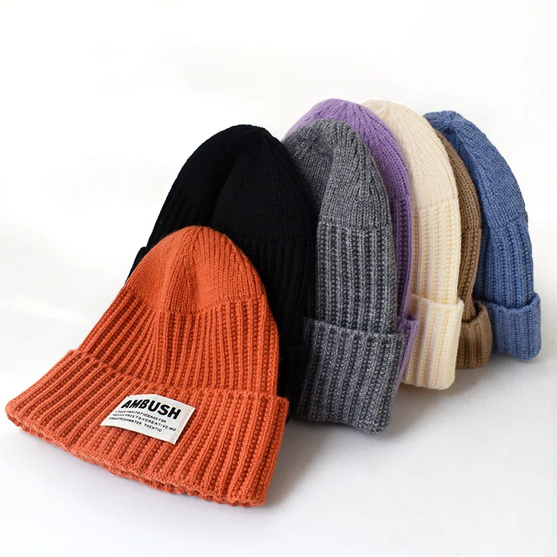 Hot sale wholesale knitted hat with custom logo knitted ear protection warm hat with cloth label for unisex