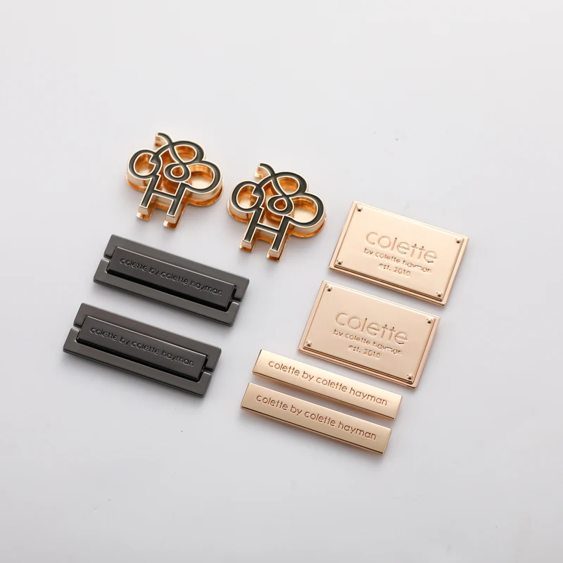Factory direct metal clothing logos labels name logo sewing engraved letter metal tag for garment accessories