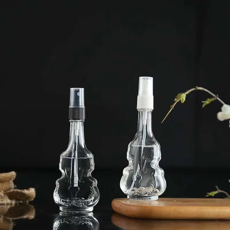 
Creative transparent glass spray bottle, violin perfume bottle Mini spot portable cosmetic packaging sub bottling 