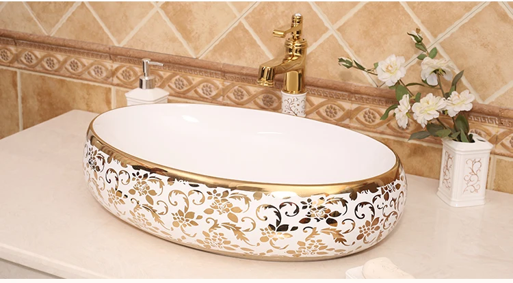 Gilded Elegance Oval Shaped Basin with Intricate Gold Designs for a Luxurious Bathroom ceramic art wash basin counter top sinks