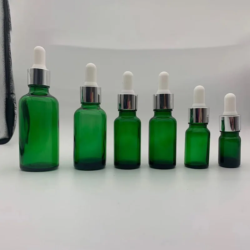 Темно-зеленая синяя стеклянная капельница, эфирное масло, пластиковая бутылка с пипеткой