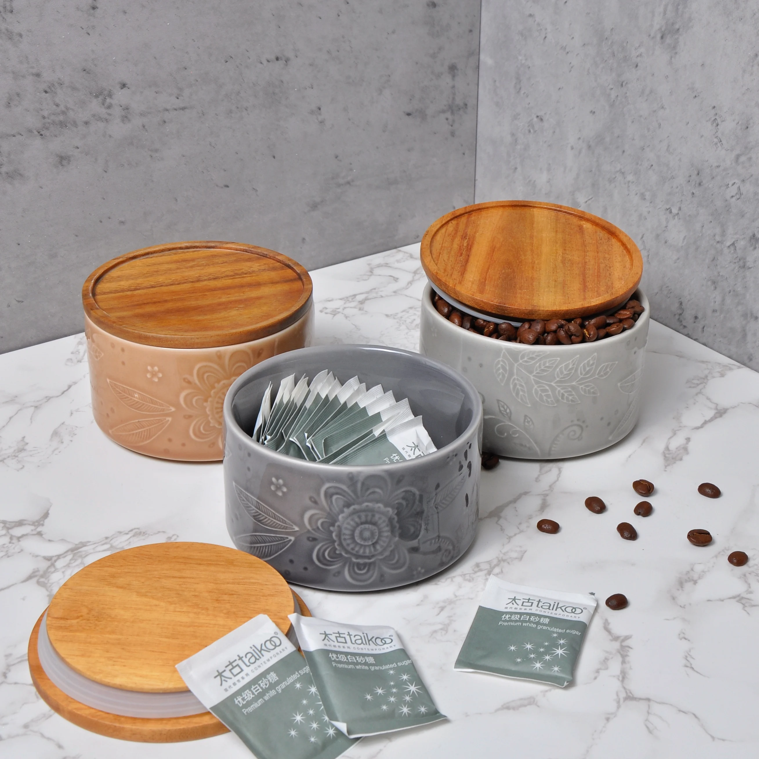 
Fashion Design Embossed Debossed Reactive Glaze Kitchen Used Stand Set Ceramic Coffee Canister With Bamboo Wood Lids 