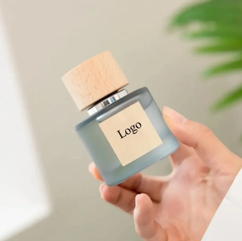 Wholesale 30ml50ml100ml Round Frosted Clear Glass Perfume Bottle with Wooden Cap Accept Customized Box