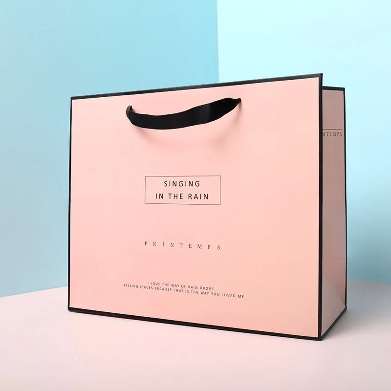 Free Design Custom Logo Matt Pink Paper Clothing Packaging Gift Paper Bag Shopping Bag Luxury Paper Bags With Ribbon Handle