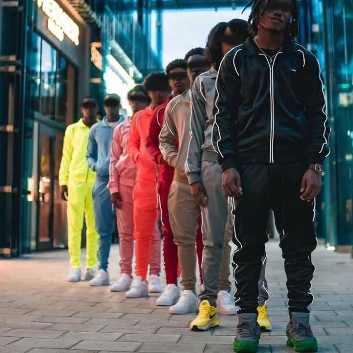 Streetwear custom reflective logo side stripe slim fit zip up nylon polyester windbreaker track jacket and pants tracksuit men