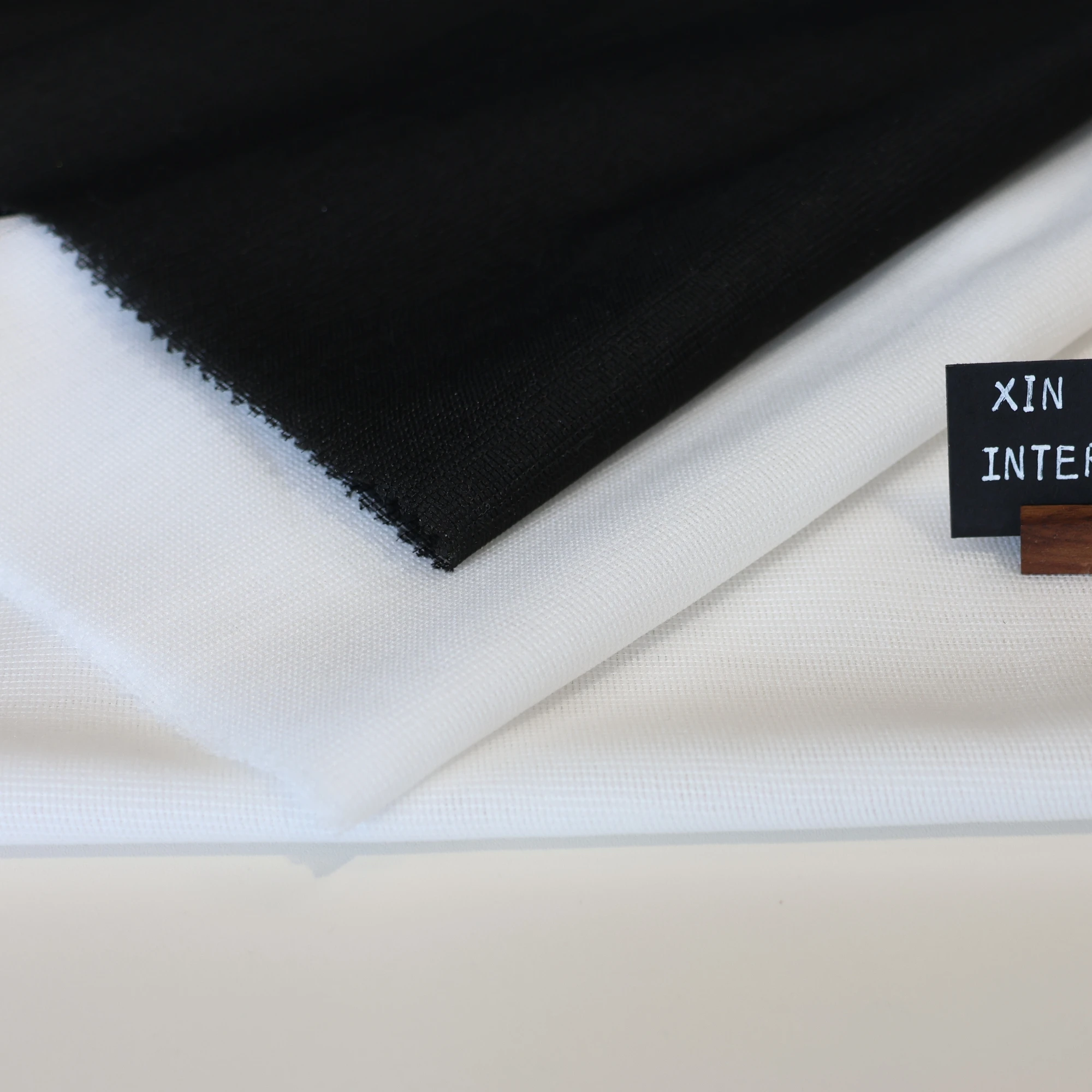 L/C support factory 100% Polyester Stretch Fusible Woven Warp Knitted Interlining