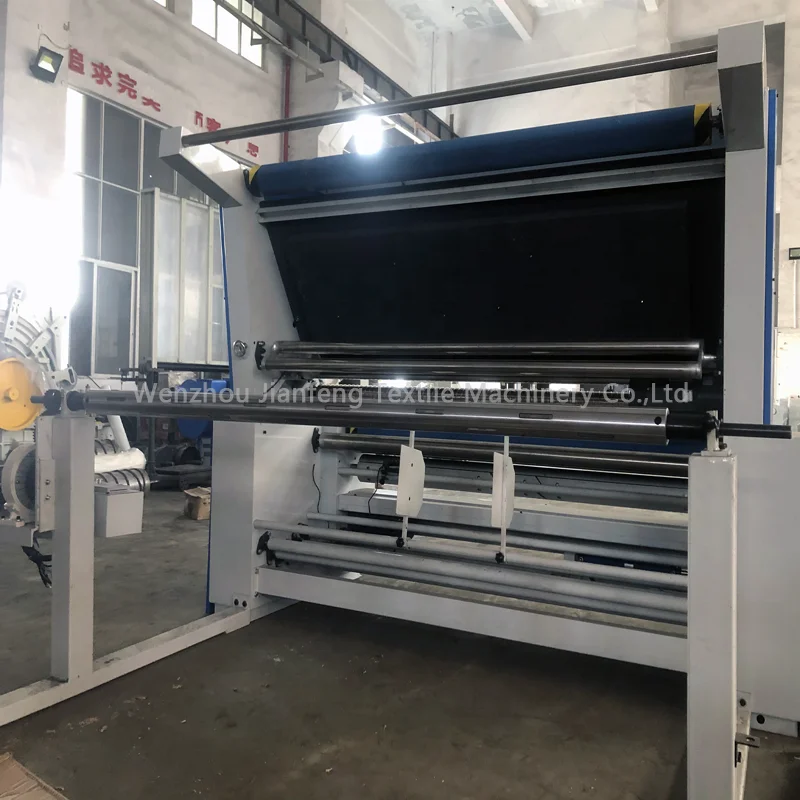 Textile fabric rewinding inspection machine