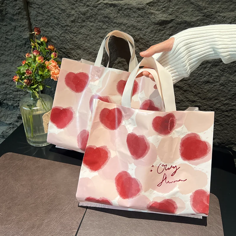 Custom plastic shopping gift bags pink for clothing custom logo foldable shopping bag reusable pe plastic bags for shops