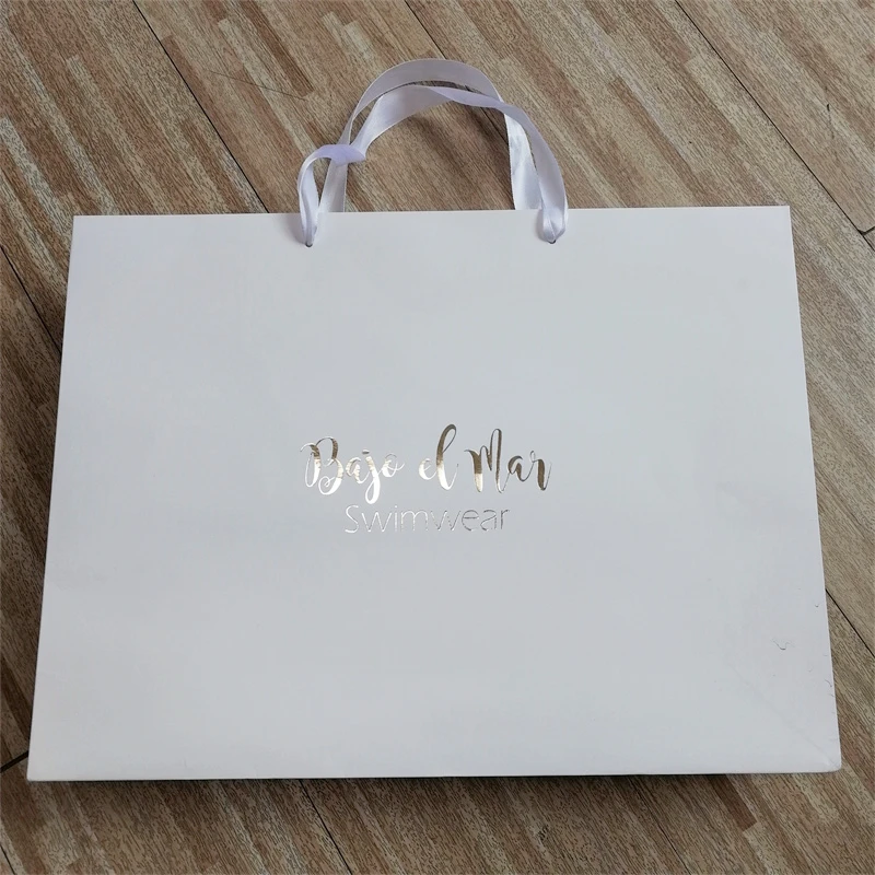 Custom White Craft Paper Bag With Logo Print Wholesale Packing Shipping Paper Bags Ribbon Handle Paper Tag For Clothes Store