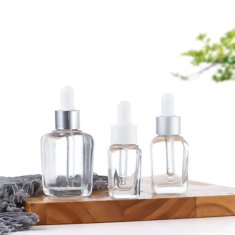 2024 modern label printing 1 ounce 50ml glass thick bottom large dropper bottle with silicone lid