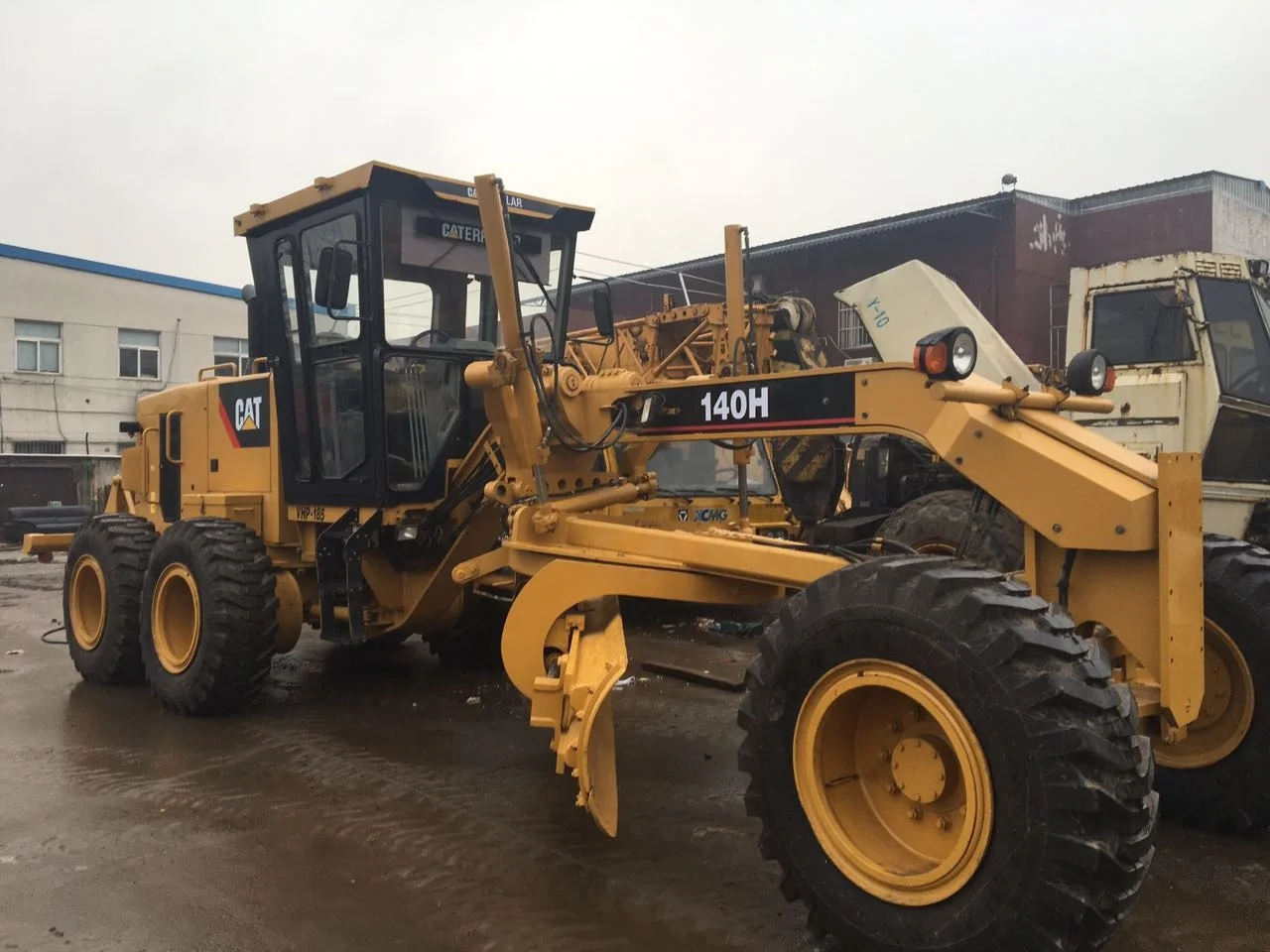Автогрейдер Caterpillar140H сделано в