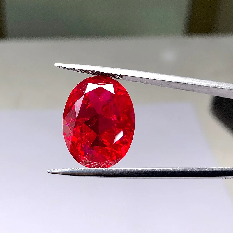 Oval shape natural cut red color synthetic ruby corundum including  minor cracks and inclusions lab created ruby loose stone
