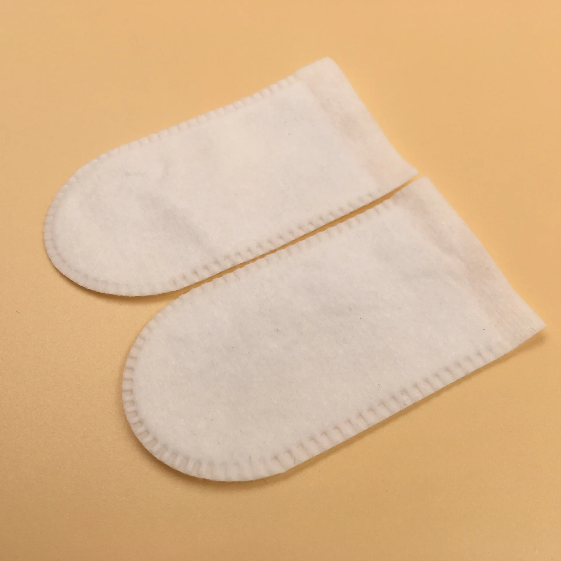 OEM Disposable non woven single finger sleeve can be used for baby or pet oral cleansing and facial makeup removal