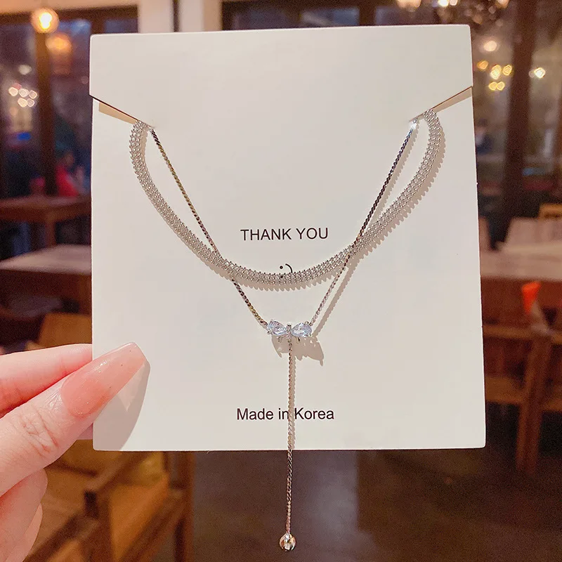 High-quality light luxury exquisite niche senior design sense double layer titanium steel zircon bow necklace