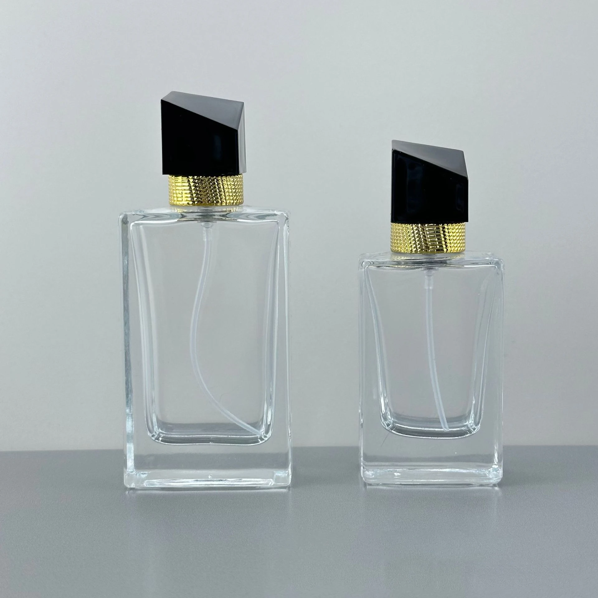 Luxury Rectangle Cosmetic Spray Bottle 30ml 50ml Clear Designer Perfume Bottle with Black Lids
