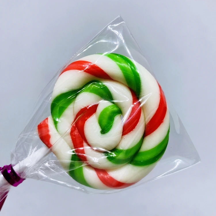 Конфеты, круглые красные и зеленые леденцы, желейные палочки, конфеты