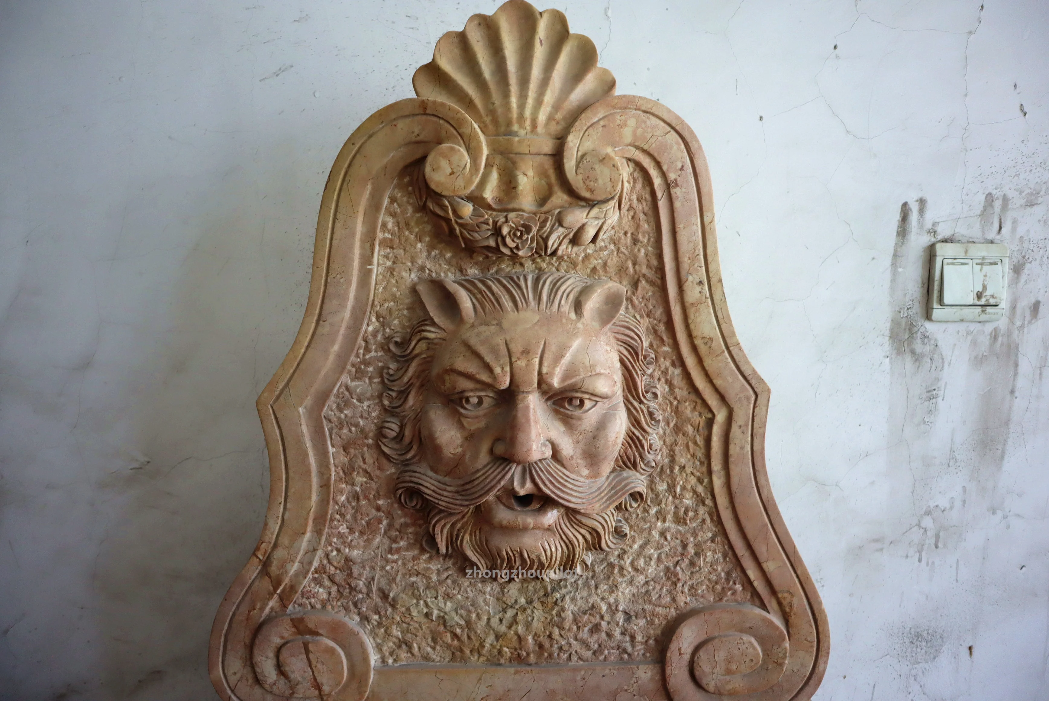 Indoor and outdoor red and beige stone small waterfall wall man head water fountain