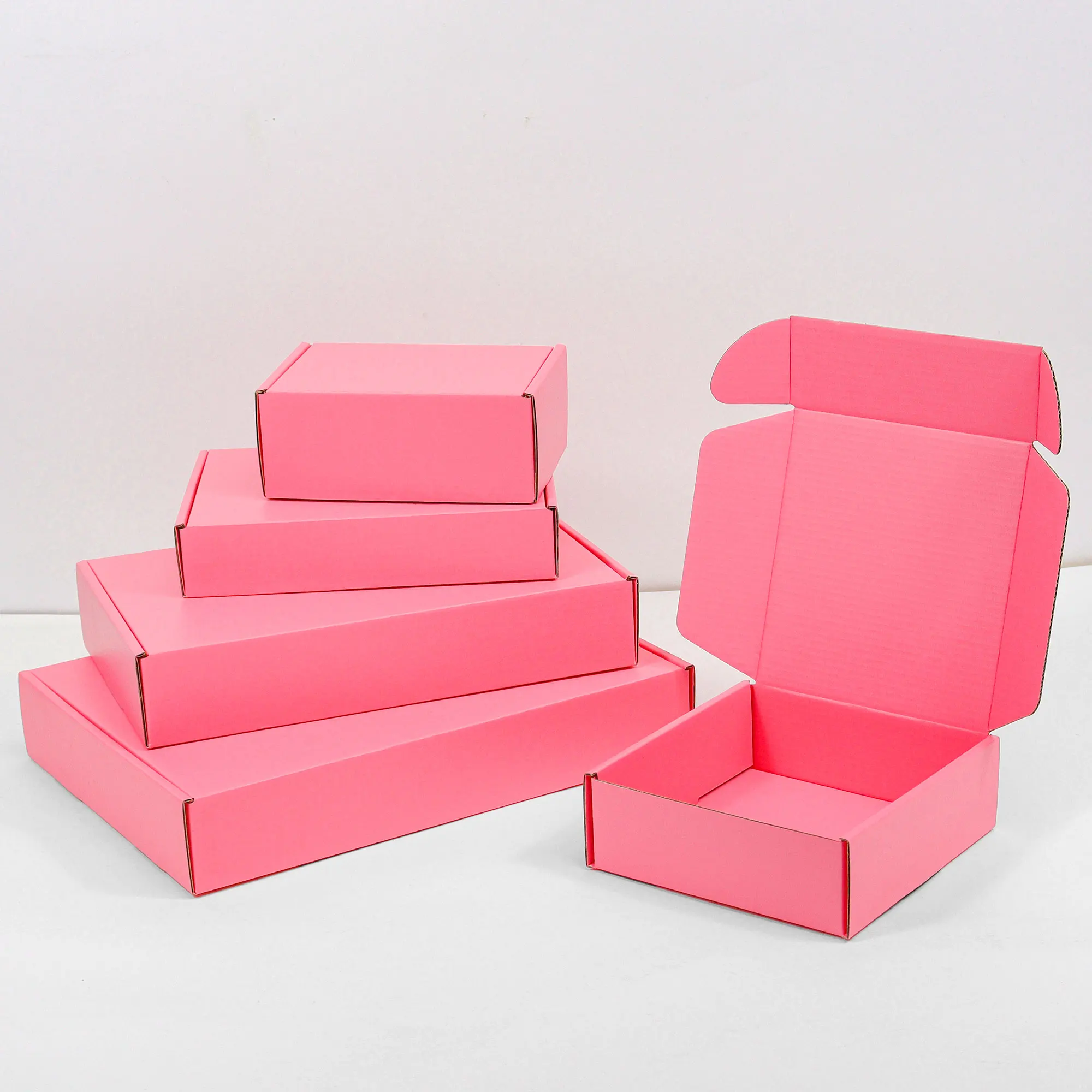 Custom pink shipping boxes for small business with logo express mailer box corrugated cardboard box packaging for clothing