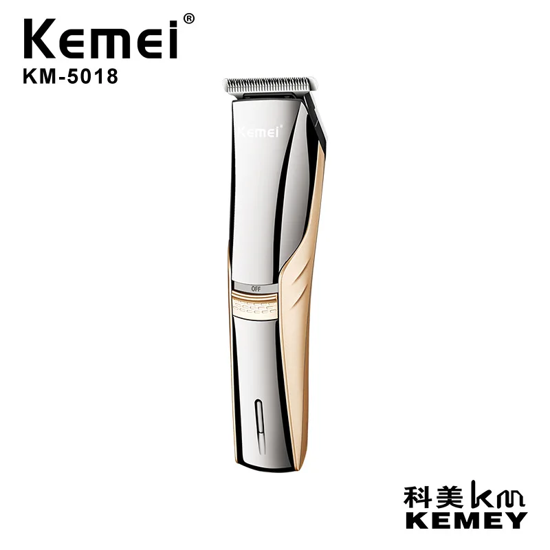 
Kemei KM-5018 углеродистая сталь лезвие профессиональное шумоподавление зарядное устройство с большим числом значений напряжения золотого и серебряного цвета; Два вида расцветки; Машинка для стрижки волос 