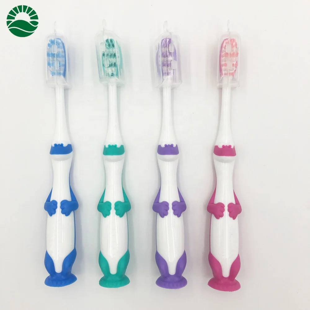Cute dragon kids personalized toothbrush with suction bottom end round tooth brush