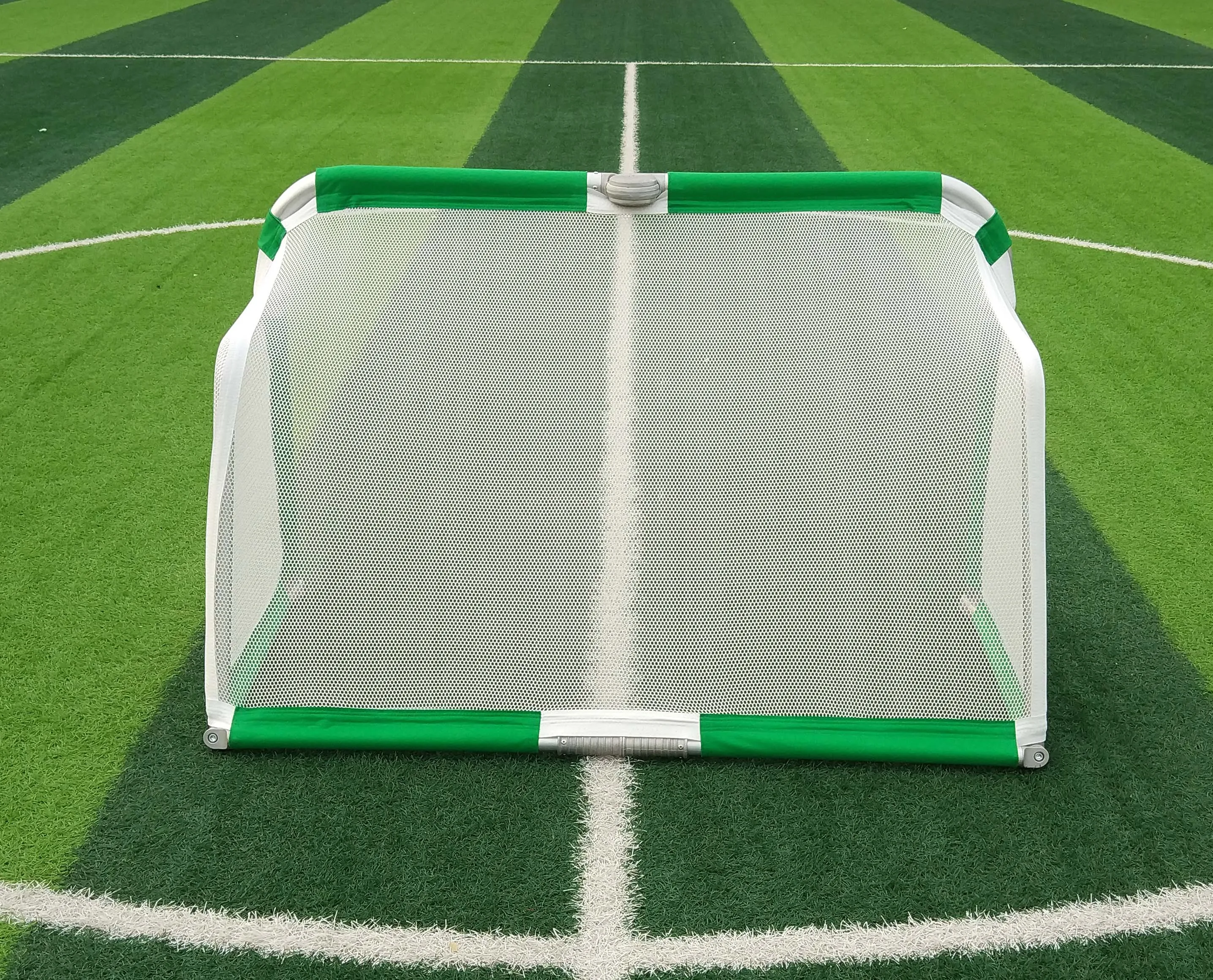 4 ft Kid using foldable mini aluminum portable soccer goal